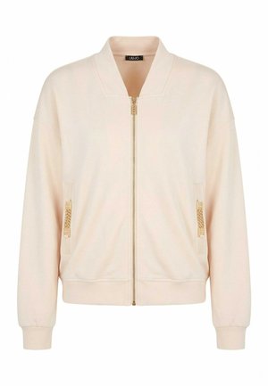 Giacca bomber beige con zip, collo, polsini e orlo a coste, e dettaglio a catena dorata sulle tasche anteriori.