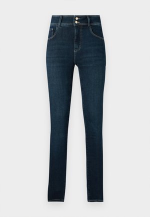 Jeans skinny blu scuro con cinque tasche, chiusura con zip e bottone, e cuciture a contrasto, realizzati in tessuto di denim.