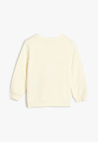 Sweatshirt de couleur crème avec des manches longues, un col rond et des bords côtes. Le dos est uni, sans motifs ni accents.