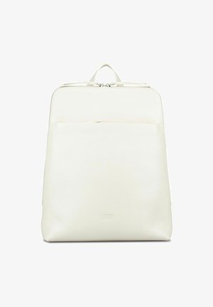White minimalist leather backpack with front pocket, top handle, and dual zipper closure.