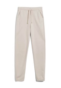 Beige Jogginghosen mit elastischem Taillenbund, Kordelzug, Seitentaschen, schmal zulaufenden Beinen und elastischen Bündchen.