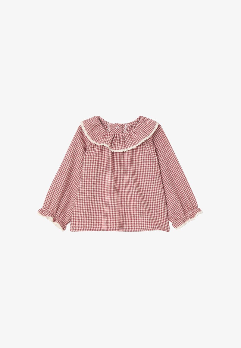 Rote Gingham-Bluse mit langen Ärmeln, Rüschensaum und Spitzenbesatz. Sie hat einen gerafften Ausschnitt und elastische Manschetten. Aus Baumwollmaterial.