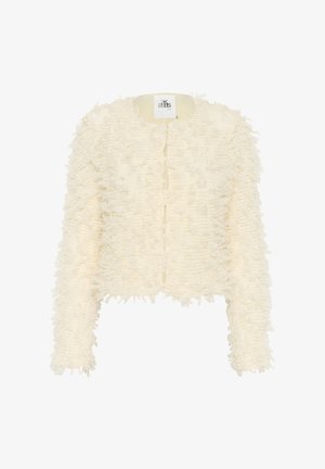 Balta apkarpyta striukė su tekstūruotu, nuskeltu paviršiumi. Apvalus iškirpimas, be užsegimo ir ilgomis rankovėmis. Etiketė matoma apykaklės vidinėje pusėje.