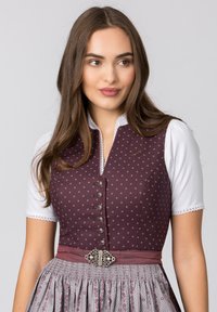 Traditional dress featuring a dark burgundy bodice with small floral patterns, a white shirt, and a gray skirt adorned with floral details.