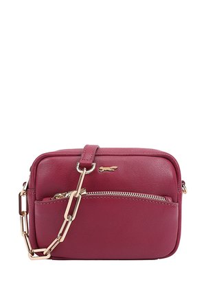 Burgundy crossbody bag made of smooth leather. Features a gold-tone zipper and chain strap with a small logo accent on the front.