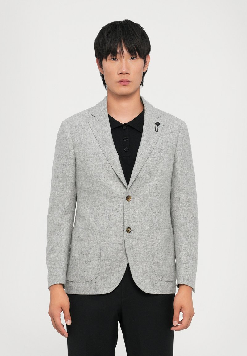 Light gray blazer with a textured fabric, two front pockets, single-button closure, and a black pin accent on the lapel.