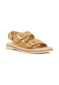 Tan suede sandals featuring two adjustable straps with gold buckles, an open toe design, and a lightweight cream-colored sole.