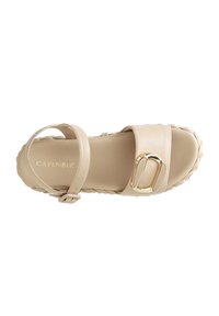 Beige sandal with a wide strap, decorative gold buckle, and braided trim. Smooth leather texture and ankle strap for secure fit.