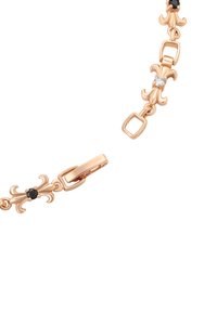 Bracciale in oro rosa con link ornamentali, pietre nere e un accento di cristallo trasparente. Texture liscia con chiusura sicura a moschettone.
