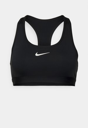 Melna sporta krūšturis, kas izgatavots no gludas auduma. Ar racerback dizainu un baltu Nike logo priekšpusē. Vienkārša un plāna forma.
