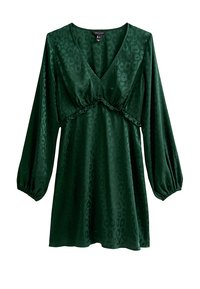 Vestido verde con estampado de leopardo con mangas largas abullonadas, escote en V profundo y una costura con volantes en la cintura. Hecho de tela suave.