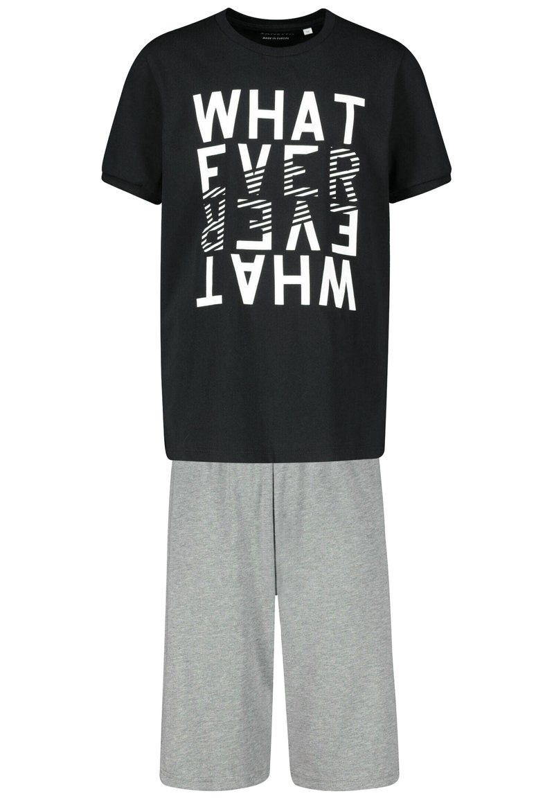 Black t-shirt with bold, reversed white text design, paired with light grey knee-length shorts made of soft fabric.