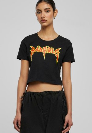 Black cropped t-shirt made of cotton featuring bold red and yellow "BADGIRLS" graphic text in a sharp, angular font.