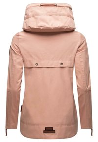 Light pink jacket with a high collar, long sleeves, back flap pocket, and a zipper at the wrist. Features branded patch at the hem.