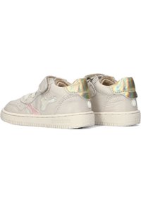Beige leather sneakers with iridescent accents, Velcro strap, rounded toe, padded collar, and textured rubber sole. Features logo detail.