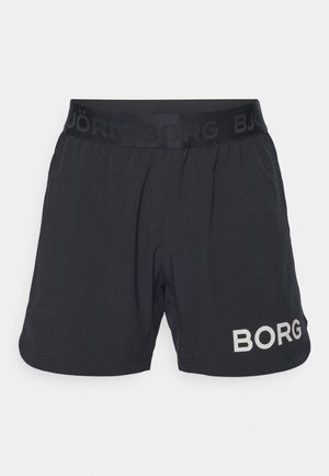 Black athletic shorts featuring a textured elastic waistband with the brand name printed in matte, and a metallic logo accent on the side.
