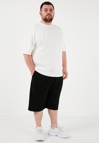 Buratti PLUS SIZE - Spodnji deli trenirk - black