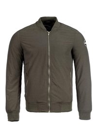 Bomberka w oliwkowej zieleni z zamkiem z przodu, ściągaczami na mankietach i u dołu, płaskim kołnierzem oraz kieszeniami po bokach. Posiada okrągłą naszywkę na rękawie.