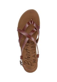 Brown leather sandal featuring crisscross straps and a padded insole. The footbed has a printed logo, with an adjustable ankle strap.