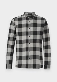 Camicia a maniche lunghe a quadri neri e grigi con colletto a punta, patta dei bottoni e una texture di tessuto morbida.