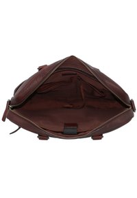 Braune Ledertasche mit glatter Oberfläche im Inneren, Reißverschlussverschluss und mehreren Fächern mit Stoffauskleidung.