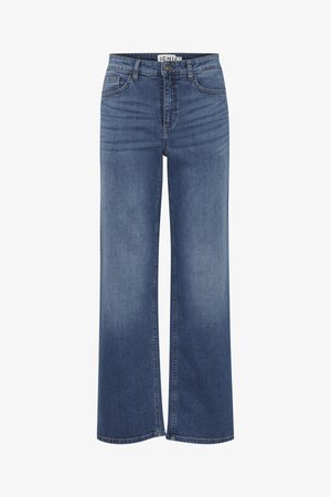 Tumedast sinisest denimist laiad püksid, millel on keskmise kõrge vöökoht, eesmistest taskutest ja kerge luitumise efekt üle kogu püksil. Klassikaline viie tasku disain.