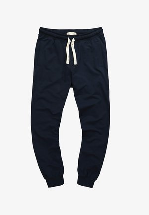 Pantaloni jogger blu navy con vita a coste, cordoncino, tasche laterali e gambe affusolate. Tessuto morbido con una texture liscia.