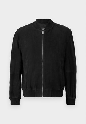 Black suede bomber jacket with a zip front, ribbed collar and cuffs, two side pockets, and a smooth texture. Simple and minimalist design.