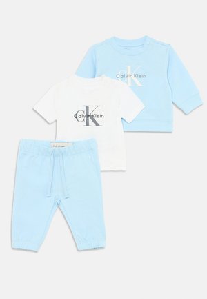 Three-piece baby outfit: a light blue long-sleeve top, a white short-sleeve T-shirt, and matching light blue pants with elastic cuffs.