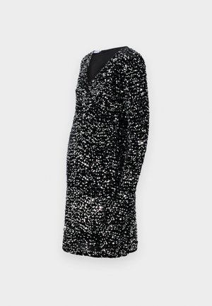 Vestido negro de mangas largas, escote en V profundo, adornado con lentejuelas plateadas, silueta ajustada, hasta la rodilla, superficie texturizada.