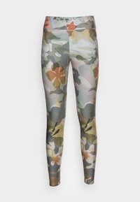 Leggings med ett färgglatt blommönster och abstrakt mönster. Tillverkade av stretchigt tyg, med hög midja och åtsittande design.