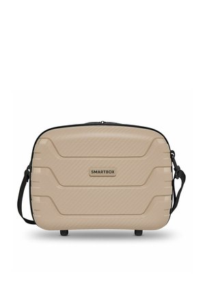 Valise cabine rigide beige avec fermeture éclair noire, bandoulière ajustable et logo "SMARTBOX" sur le panneau avant.