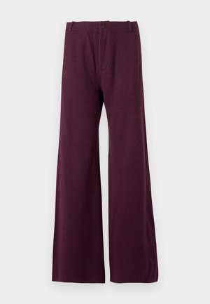 Bordo nohavice s širokými nohavicami vyrobené z ľahkého materiálu. Majú predné zapínanie na gombík a zips, s hladkou, jednotnou textúrou.