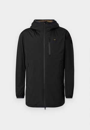Black waterproof jacket with a hood, front zipper, chest pocket, and elastic cuffs. Smooth texture, minimalistic design, and no visible patterns.