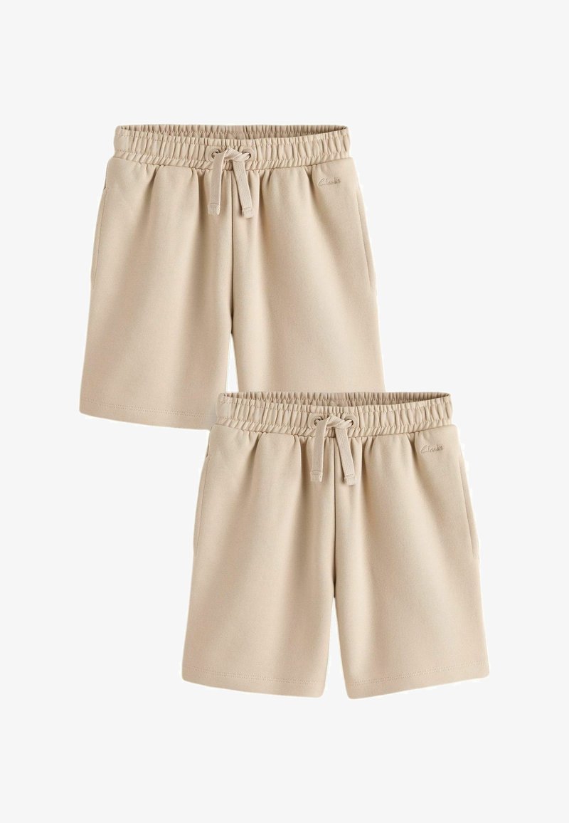 Shorts beiges à taille élastique avec cordons, poches latérales et logo subtil de la marque à l'avant, vus de face.