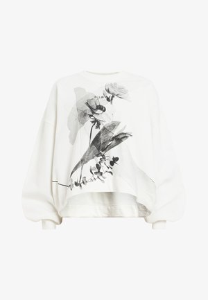White sweatshirt with a relaxed fit, featuring a black floral graphic on the front, high neckline, and wide sleeves. Text detail at the top.