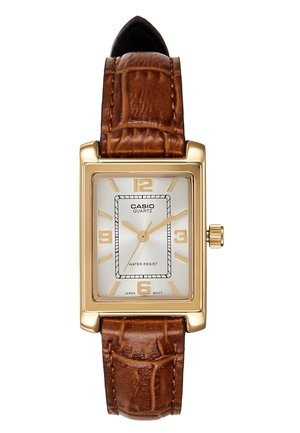 Montre Casio rectangulaire en or avec bracelet en cuir marron et cadran blanc simple affichant l'heure à 1:10:35.