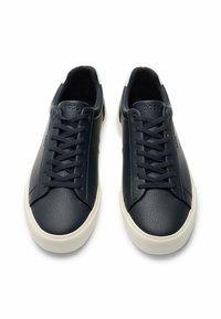 Dark navy leather sneakers with textured upper, white rubber sole, and flat laces. Features logo embossed on tongue and side panel.