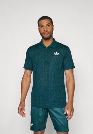 Teal polo shirt with a diamond pattern, zip-up collar, and white adidas logo. Paired with matching teal shorts. Smooth texture.