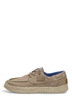 Zapato casual de lona beige con cordones en la parte delantera, entresuela de cuerda tejida, suela clara y forro interior azul con estampado, mostrado desde el lado exterior.