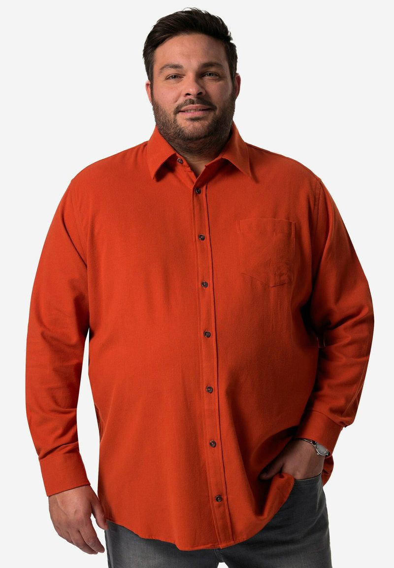 Oranje overhemd met knopen, voorzien van een borstzak, lange mouwen en een ontspannen pasvorm. Bevat zwarte knopen en een zachte, textuurrijke stof.