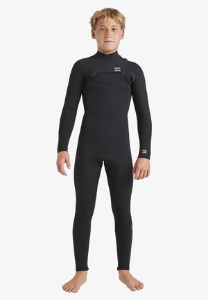 Mute nera con maniche lunghe e gambe lunghe, dotata di una zip frontale e pannelli testurizzati sulle ginocchia. Progettata per comfort e flessibilità in acqua.