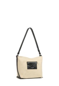 Borsa in canvas beige con una tasca frontale in pelle nera, manico nero e cuciture a contrasto. Texture morbida, design minimalista e dimensioni medie.