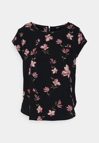 Blouse noire à manches courtes avec un motif floral rose et crème, dotée d'un col rond et d'une petite fermeture éclair au dos. Tissu doux.