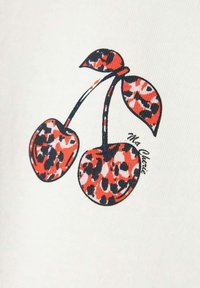 Tissu blanc avec un motif graphique de deux cerises ornées de motifs léopard rouges et noirs et d'un contour noir, accentué par un nœud.