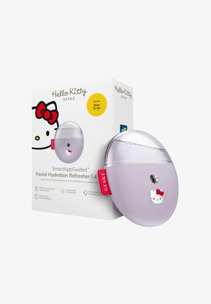 Dispositif rafraîchissant d'hydratation faciale sur le thème Hello Kitty avec design ovale compact, dessus transparent et étiquette rouge, présenté à côté de sa boîte blanche de produit.