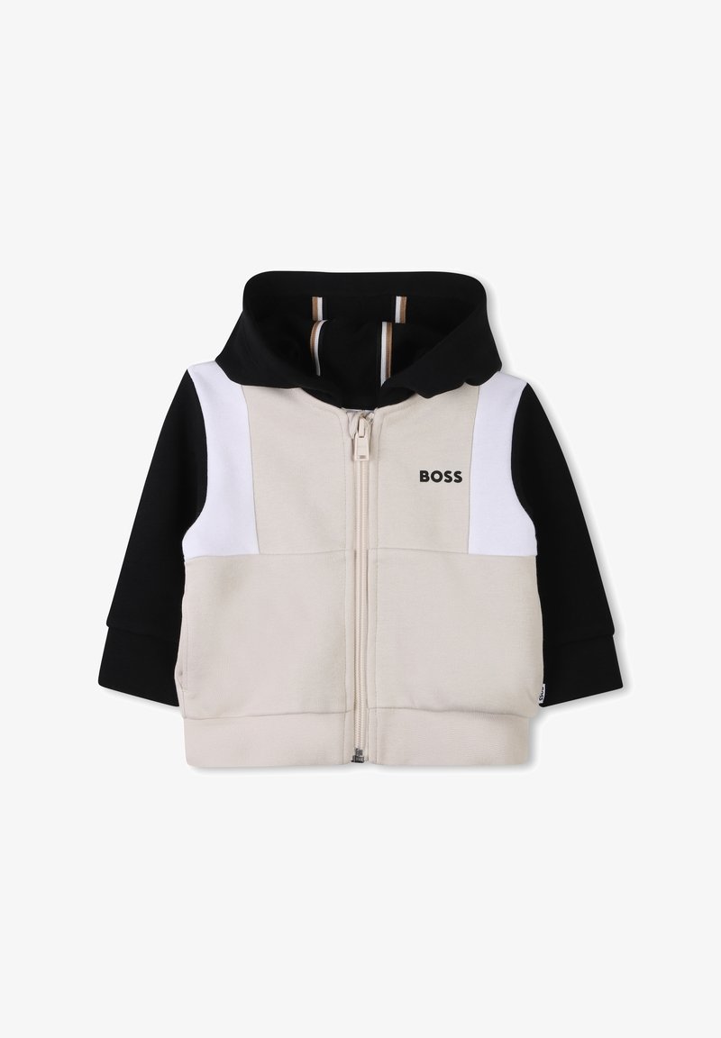Sweat-shirt à capuche avec un devant beige, des manches noires, des accents blancs, une fermeture éclair et le logo "BOSS" sur la poitrine. Texture douce.