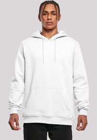 White pullover hoodie made from soft fabric, featuring a front pocket, adjustable drawstrings, and ribbed cuffs and hem.