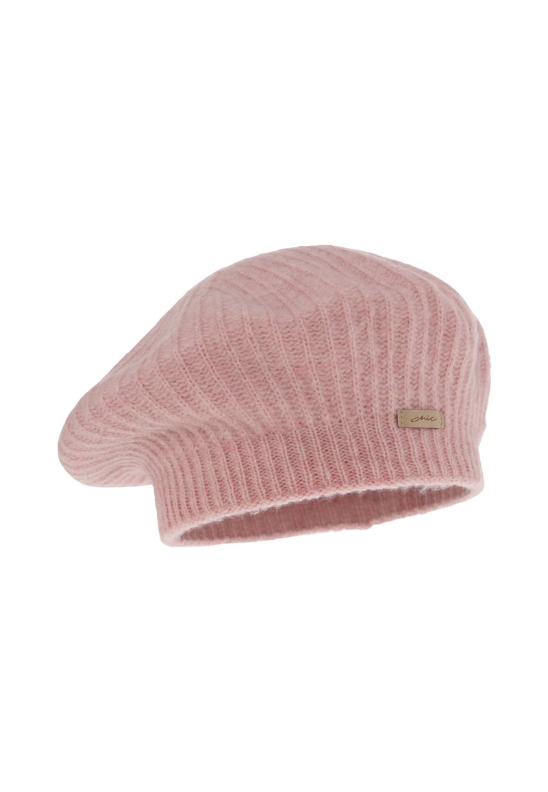 Berretto rosa polveroso con texture a coste e una finitura morbida. Presenta un piccolo etichetta con il marchio sul lato.