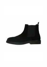 Bottines Chelsea en daim noir avec des panneaux latéraux élastiques et une languette, dotées d'une semelle en caoutchouc texturé. Design classique à mi-mollet.